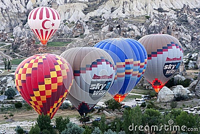 Hot air ballons prepare to take off at sunrise near Goreme in the Cappadocia region of Turkey. Editorial Stock Photo