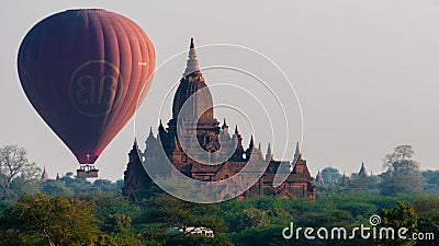 Hot air balloon behind temple in Bagan Editorial Stock Photo