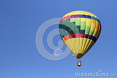 Hot air balloon flies with the moon in the background Editorial Stock Photo