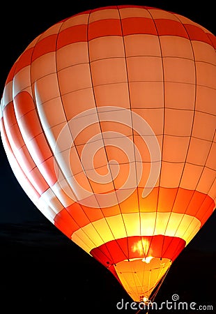Hot Air Balloon Glowing In The Night Stock Photo