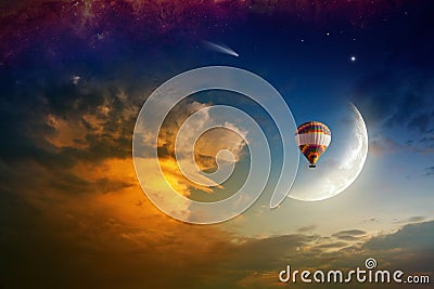 Hot air balloon in glowing sky with rising moon Stock Photo