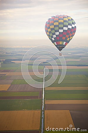 Hot air balloon with green Dutch landscape Stock Photo