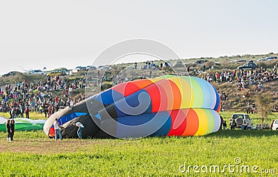 Hot air balloon lying on ground Editorial Stock Photo