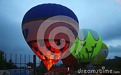 Hot air balloon starting to fly in evening sky Editorial Stock Photo