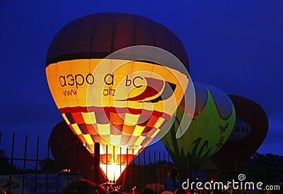 Hot air balloon starting to fly in evening sky Editorial Stock Photo