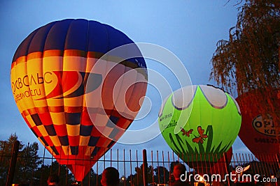 Hot air balloon starting to fly in evening sky Editorial Stock Photo