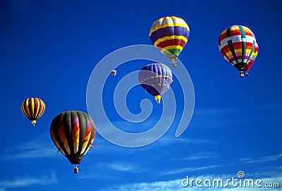 Hot air balloons agaisnt blue sky Stock Photo