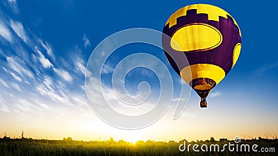 Hot air balloons flies in blue sky Stock Photo