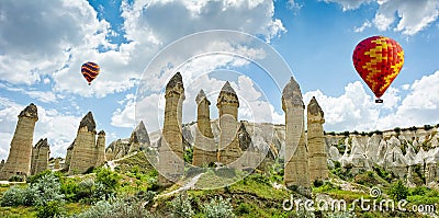 Hot air balloons flying over Love valley at Cappadocia, Turkey Stock Photo