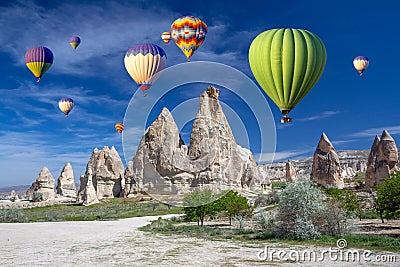 Hot air balloons over the cave town, Valley of Daggers, Cappadocia, Turkey Stock Photo