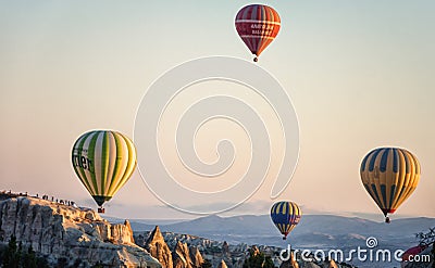 Hot air balloons between the texture of rocks in cappadoccia at sunrise Editorial Stock Photo