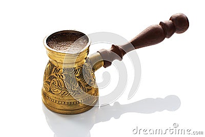 Hot arabica coffee in a brass jezve Stock Photo