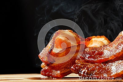 Hot Bacon With Steam Isolated on Black Stock Photo