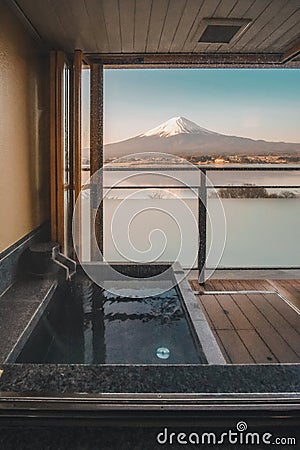 Hot bath Japanese onsen in Traditional ryokan resort with beautiful Mt.Fuji view background at Kawaguchiko lake, Yamanashi, Japan Editorial Stock Photo