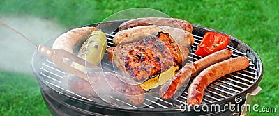 Hot BBQ Grill With Assorted Meat On The Garden Lawn Stock Photo