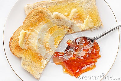 Hot buttered toast and marmalade Stock Photo