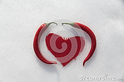 Hot chili love in the snow Stock Photo