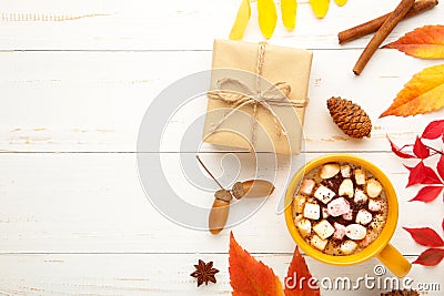 Hot chocolate and autumn leaves on grey wooden bakground - seasonal relax concept Stock Photo