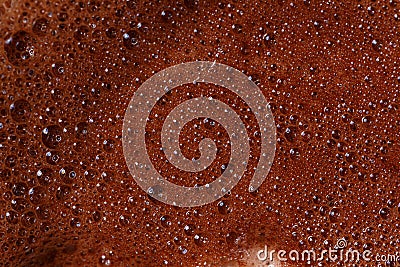 Hot chocolate foam close-up, macro. Abstract background. Black coffee with milk cream foam texture Stock Photo