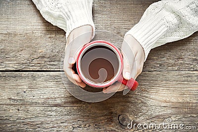 Hot chocolate in hands Stock Photo