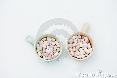 Hot chocolate with marshmallow and candy cane sweets in cups for holiday Stock Photo