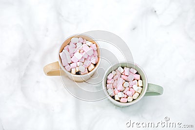 Hot chocolate with marshmallow and candy cane sweets in cups for holiday Stock Photo