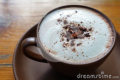 Hot cocoa with frothed milk in ceramic cup Stock Photo