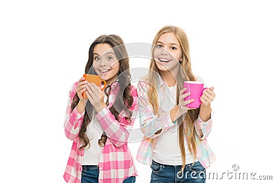 Hot cocoa recipe. Children drink enough during school day. Make sure kids drink enough water. Girls kids hold cups white Stock Photo