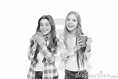 Hot cocoa recipe. Children drink enough during school day. Make sure kids drink enough water. Girls kids hold cups white Stock Photo