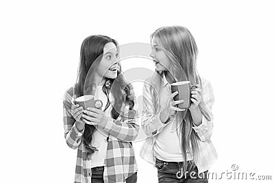 Hot cocoa recipe. Make sure kids drink enough water. Girls kids hold cups white background. Sisters hold mugs. Drinking Stock Photo