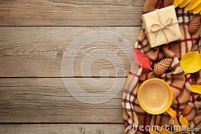 Hot coffee and autumn leaves on grey wooden background - seasonal relax concept Stock Photo