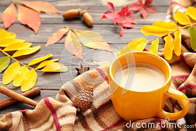 Hot coffee and autumn leaves on plaid - seasonal relax concept Stock Photo