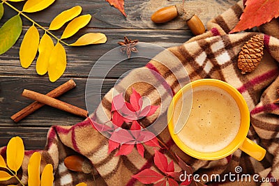 Hot coffee and autumn leaves on plaid - seasonal relax concept Stock Photo