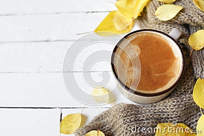 Hot coffee and autumn leaves on white wood background - seasonal relax concept Stock Photo