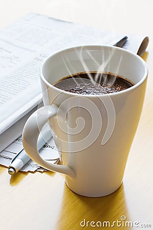 Hot coffee, ball-point and newspaper Stock Photo