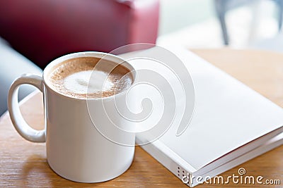 Hot coffee with book on table. Take a break concept. Stock Photo