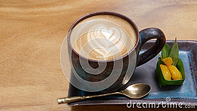 Hot coffee cappuccino latte art with thai style dessert top view Stock Photo