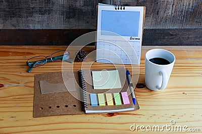 Hot coffee with mobile phone on the wood table Stock Photo