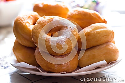 Hot confectioners have just been sentenced and laid out on dishes and sprinkled with powdered sugar. Stock Photo