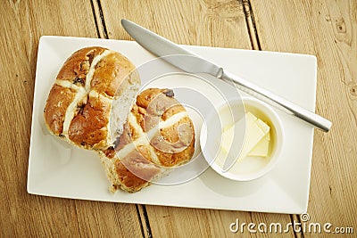 Hot cross bun on white dish Stock Photo