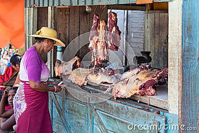 A hot day in Miandrivazo, Madagascar, with a street stall butcher shop open Editorial Stock Photo