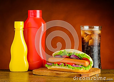 Hot Dog with Ketchup, Mustard and Glass of Cold Cola Stock Photo