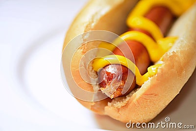 Hot dog with mustard closeup Stock Photo