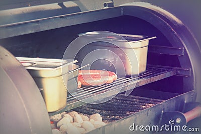 Hot dogs cooking on a bbq at market Stock Photo