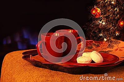 Hot Drinks and Powdered Sugar Donuts by the Fire Stock Photo