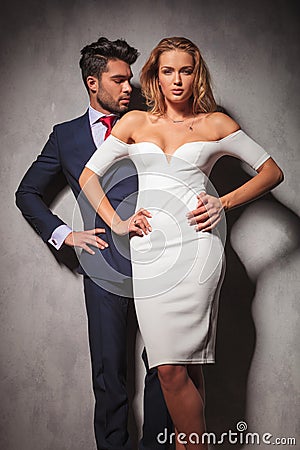 Hot elegant fashion couple standing with hands on hips Stock Photo