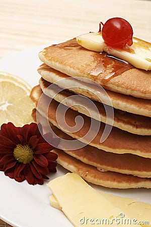 Hot flapjacks with syrup Stock Photo