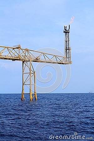 Hot flare boom and fire on offshore platform Stock Photo