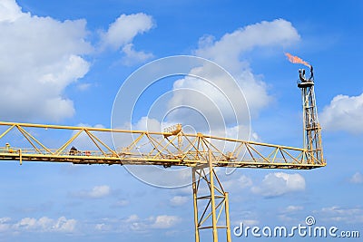 Hot flare boom and fire on offshore platform Stock Photo