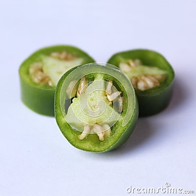 hot green chili sliced pile photos with isolated background Stock Photo